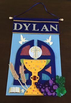 a banner with the word dylan on it and some grapes in front of it