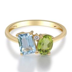 This alluring toi et moi ring features one emerald cut blue topaz, one oval peridot and one brilliant cut diamond accent in a glistening 10K yellow gold setting. | Blue Topaz, Peridot and Diamond Toi et Moi Ring | 10K Yellow Gold | Size 6 | Helzberg Diamonds Peridot Ring Gold, Dual Birthstone Ring, Stone Ring Design, Birthstone Engagement Rings, August Birthstone Ring, Radiant Engagement Rings, Colored Stone Rings, Multi Gemstone Ring, Helzberg Diamonds