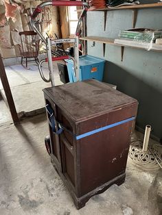 an old brown box sitting in the middle of a room