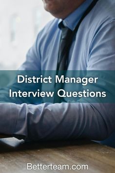 a man sitting at a table with his laptop and the words district manager interview questions