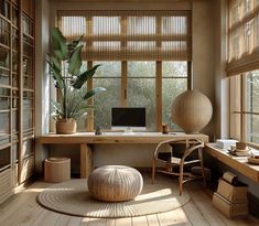 a home office with wooden floors and large windows