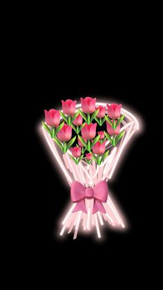 a bouquet of pink roses in a diamond shaped vase with a bow on the side