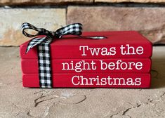 three red books with the words twas the night before christmas tied to each other