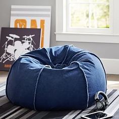 a bean bag chair sitting on top of a rug