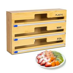 three wooden drawers with different types of fruit on them and a plate next to it