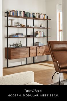 a living room filled with furniture and bookshelves