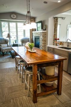 a large kitchen with an island in the middle