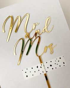 a cake topper with the words mr and mrs on it