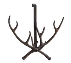 a coat rack with antlers hanging from it's sides on a white background