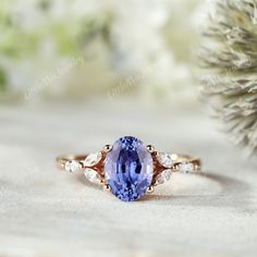 a tan and blue ring sitting on top of a table