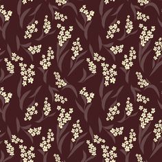 a brown and white flower pattern on a maroon background