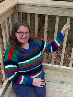 One of a kind striped pullover sweater crocheted in blue, green, red, magenta, navy, & off-white!  Washable (gentle cycle, low heat dry) Measurements: Chest: 42 in Length: 23 in Free Shipping! For more unique handmade sweaters, click here: https://www.etsy.com/shop/ChristianneCrochets?ref=seller-platform-mcnav&section_id=31124024 See all the handmade items available in my shop: https://www.etsy.com/shop/ChristianneCrochets Winter Striped V-neck Sweater With Long Sleeves, Winter Striped V-neck Long Sleeve Sweater, Winter Striped Long Sleeve V-neck Sweater, Striped Long Sleeve V-neck Sweater For Winter, Striped Knit Sweater For Fall, Sweater With Stripes, Handmade Sweaters, Handmade Sweater, Striped Pullover