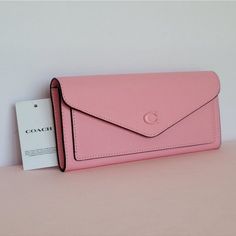 Questions? Leave A Comment Below! Envelope Clutch For Daily Use, Spring Bags With Card Slots, Elegant Pink Coach Clutch, Chic Coach Wallets, Chic Spring Wallets, Chic Envelope Wallet With Removable Pouch, Chic Envelope Travel Wallet, Chic Travel Envelope Wallet, Chic Pink Leather Wallet