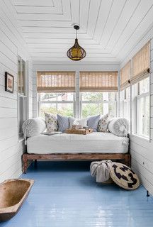 a bedroom with blue flooring and white walls is pictured in this image from the inside