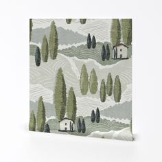 an image of a wall hanging with trees and houses in the woods on it's side