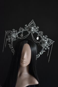 Halo crown is decorated with epoxy resin skulls. This crown is made with filigree, decorative ribbon, glass and plastic beads, chain. The gothic crown is available in different colors (see last photo). The crown in the photo in old silver color. Unique and impressive look of the crown will not leave you without attention at any event! Сrown height 16 cm (6.3 inch), crown widht is above 39 cm (15.3 inch) Goth Crystal Crown, Luxury Black High Crown Costume Hat, Luxury Gothic Festival Headpieces, Gothic Bride Crown, Luxury Black Headpiece With Pinched Crown, Crown Jewelry Pagan, Evil Crown Quinceanera, Monster Can Crown Tutorial, Rebecca + Core + Aesthetic