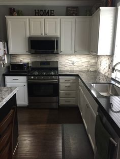 the kitchen is clean and ready for us to use it's new counter tops