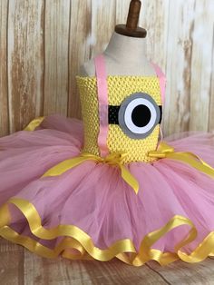 FREE SHIPPING on all orders within the US, no coupon code needed! Pink Minion Tutu by Little Ladybug Tutus. Handmade Tutus for girls specializing in birthday party dresses, Halloween costumes, flower girl dresses, pageant tutus, 1st birthday tutus, and blinged Converse sneakers. We accept custom orders! ORDER PRODUCTION TIME Please check the top of our website's home page for current turn around time. Since all items are handmade at the time of purchase, there is a production time that varies. W Minion Tutu, Pink Minion, Minion Dress, Tutu Dress Pink, Minnie Costume, Minnie Mouse Tutu Dress, Ladybug Tutu, Minion Costume, Minnie Mouse Tutu