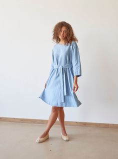 "PRODUCED in 3-5 days FAST & FREE shipping with DHL Express Courier -10% for all items with code \"FAVOURITE\" Featuring a steel blue hue and relaxed silhouette, this dress is a true secret. With a loose silhouette, it looks breezy and bohemian.  And when styled with an adjustable belt it looks elegant and graceful. Trust your feelings and choose your favorite image!  Details: - 100% Linen - Pure linen fabric - 3/4 sleeves - Boat neck - Two side pockets - Relaxed silhouette - Above knee length - Adjustable belt - Model's height is 180 cm / 5'11'' wears size M - Code: E9018-L532-126 The dress is available in other colors. You can find them in the gallery. If you want to order the dress in another color, please specify it in the personalization field. Sizing: This garment is true to size, an Spring Blue Linen Dress For Daywear, Light Blue Linen Dress For Spring, Spring Linen Belted Dress, Blue Knee-length Belted Summer Dress, Casual Blue Linen Dress For Work, Light Blue Linen Dresses For Spring, Blue Linen Knee-length Dress With Relaxed Fit, Blue Knee-length Linen Dress With Relaxed Fit, Blue Belted Summer Dress