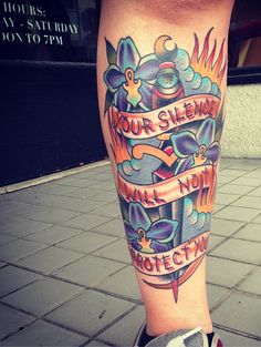 a person with a tattoo on their leg that says, your silence will not protect you