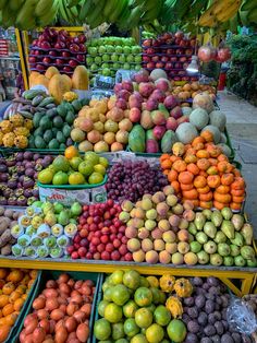 a fruit stand with many different types of fruits