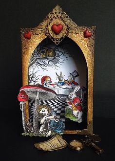 the alice and the wonderland tea party is displayed in an ornate gold frame with red hearts