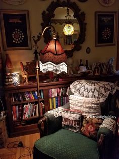 a living room filled with lots of books and furniture