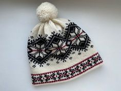 This winter hat with Norwegian pattern is extra warm, protecting a head in cold and windy weather. This winter hat has a wool inner making it comfortable to wear. This hat can be a perfect gift for Christmas. The hat is made of 100% natural wool from sheep, which assures natural and environmental friendliness. All wool items in my shop are washed - Ready to wear! Material: 100% wool Colours: -White/Black Sizes: *Head circumference: 54-56cm (21.26-22.05in) Hat height: 23cm (9.06in) *57-59cm (22.4 Winter Bonnet For Cold Weather, Brimmed Winter Bonnet For Cold Weather, Warm Nordic Hats For Outdoor, Nordic Style Warm Outdoor Hats, Winter Brimmed Knitted Bonnet, Warm Hat For Winter Sports, Cream Winter Bonnet Cap, Winter Cream Bonnet Cap, Cream Beanie Bonnet For Winter