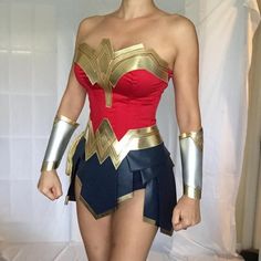 a woman dressed up in a wonder costume