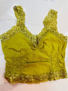 This is the perfect layer to add under a tank or off shoulder. I wear mine with a bra to over my straps with a cute lace detail but keep the support I need. Fit: O/S fits most, Anna is a 36 C/D and wears this size Fabric: 92% Nylon, 8% Spandex Summer Lace Camisole Bra Friendly, Summer Lace Tank Top Bra Friendly, Seamless Lace Top For Summer, Summer Bra Friendly Lace Cami Top, Lace Tank Top Bra Friendly, Fitted Lace Tank Top With Straps, Sleeveless Lace Crop Top With Straps, Lace Camisole Bra, Seamless Lace Tank Top For Summer