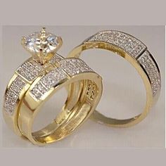 two gold wedding rings with diamonds on each one and an engagement ring in the other