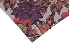 a tie with flowers on it is shown in purple, pink and red colors that are very similar to the same color scheme