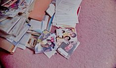 a pile of newspapers and magazines on the floor