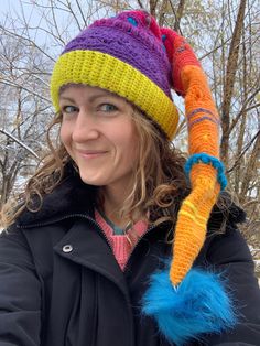 Stay warm with a touch of whimsy in this colorful sleeper hat.  Handmade with color changing yarn and without a pattern, each hat is created as a work of art making it a one-of-a-kind. Whimsical Yarn Mini Hats For Winter, Whimsical Winter Yarn Mini Hats, Playful Multicolor Costume Hats, Whimsical Crochet Cap For Winter, Whimsical Adjustable Crochet Winter Hat, Whimsical Winter Crochet Cap, Playful Multicolor Hat One Size Fits Most, Whimsical Adjustable Multicolor Hat, Playful Multicolor Adjustable Costume Hats And Headpieces