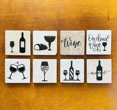 four coasters with different types of wine on them