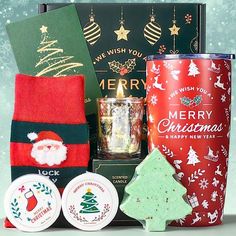 a christmas hamper with coffee, cookies and other holiday treats in it's gift box