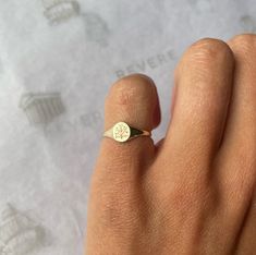 Our daintiest signet ring. Perfect for pinkies or petite hands Some of our engraving options have been removed for the demi signet ring due to its dainty size 6x5.5mm face 14k solid yellow gold All Revere signet rings are crafted using the traditional die-struck method and are karat stamped guaranteeing the gold content Demi signet rings can be paired with a custom fit diamond stacking band Unsure of your ring size? We will send you a ring sizing kit Dainty Pinky Ring, Diamond Stacking Band, Stacked Diamond Bands, Pinky Signet Ring, Signet Rings Women, Signet Rings, Stacking Bands, Silver Signet Ring, Gold Signet Ring