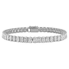 17.01ctw Oval Tennis Bracelet, a timeless symbol of elegance and grace. Crafted with precision and finesse, this exquisite bracelet features 41 dazzling oval diamonds, each measuring 5.5x4.1mm. Set in luxurious 18kt white gold, these diamonds boast a total weight of 17.01 carats and exhibit stunning white color and VS clarity. With a classic 7-inch length, this tennis bracelet exudes sophistication and charm, making it the perfect accessory for any occasion. Indulge in the unmatched beauty and b Luxury Oval Tennis Bracelet Fine Jewelry, Luxury White Gold Oval Bracelets, Luxury White Gold Oval Diamond Bracelet, Luxury Oval Diamond White Bracelet, Luxury Timeless Oval Diamond Bracelet, Luxury White Oval Diamond Bracelet, Oval Tennis Bracelet, Luxury Oval Diamond White Diamond Bracelet, Luxury Diamond White Oval Diamond Bracelet