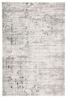 an area rug with grey and white colors on the floor, in front of a white background