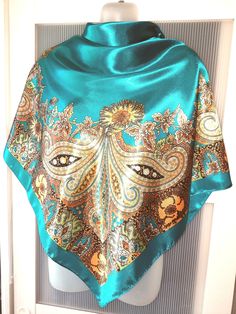 Absolutely gorgeous teal green and blue/turquoise large square silk satin scarf that will add riches to your outfit! The scarf is designed in the best oriental traditions with red and orange paisley design. The shawl can be used for a very special occasion like an engagement or wedding celebration! The color of the scarf is between teal green and teal blue depending on the light. No tag is attached, however the scarf is in excellent/mint condition and comes in a gift wrap and with a 'Thank you' Blue Satin Silk Scarf As Gift, Blue Satin Silk Scarf For Gift, Blue Satin Scarves, Blue Square Scarves For Gifts, Blue Square Scarves As Gift, Teal Scarf, Large Square Scarf, Satin Scarf, Paisley Scarves