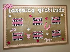 a bulletin board with pink and black decorations on it that says lassong gratitude