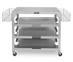 a stainless steel cart with three drawers and two baskets on the top, in front of a white background