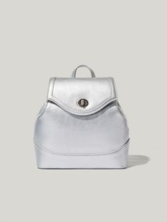 Editor's NoteBAG TO BASICS's bag is designed for its practicality for everyday wear.- Turn lock decoration with engraved brand logo- Inner zipper pocket- Length adjustable straps- Spacious and feminine backpack Measurements (in.)- Size: 9.06 in. * 9.25 in. * 3.94 in.- Strap: 0.59 in. * 28.35 in. ~ 35.43 in.Composition & Care- Poly / Artificial Leather- The leather may have fine scratches and wrinkles- Professional cleaning is neededDesigner- by BAG TO BASICS Silver Satchel With Adjustable Strap For Travel, Silver Travel Satchel With Adjustable Strap, Trendy Silver Satchel For Travel, Silver Standard Backpack For Everyday Use, Silver Everyday Backpack, Silver Satchel Bag With Adjustable Strap, Silver Backpack For Travel, Modern Silver Bag With Magnetic Closure, Silver School Backpack