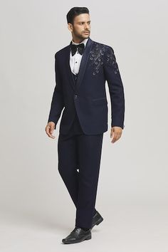 Blue tuxedo jacket with cutdana embellished floral patterns. Comes with inner shirt, waistcoat, pant and bow-tie. - Aza Fashions Semi-formal Tailored Embroidered Tuxedo, Blue Tuxedo Jacket, Shawl Collar Tuxedo, Waistcoat Pattern, Blue Tuxedo, Blue Tuxedos, Tuxedo Pants, Suiting Fabric, Tuxedo Shirts