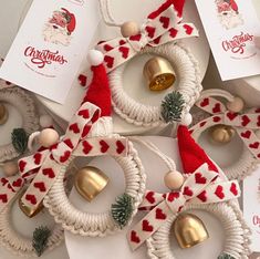 several christmas wreaths with bells and ornaments attached to them on top of each other