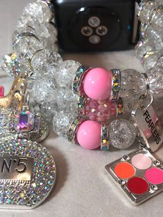 Clear with a splash of pink Apple Watch band ( design available for other smart watches ) charms may vary based on your sentimental values and available charms,. Please include your wrist size. Trendy Pink Beaded Bracelets With Charms, Trendy Pink Jewelry With Bracelet Strap, Trendy Pink Charm Bracelets, Adjustable Pink Bracelet With Removable Charms, Trendy Pink Bracelets With Charms, Adjustable Pink Jewelry With Removable Charms, Pink Bracelet With Removable Charms, Apple Watch Bracelet Band, Pink Apple Watch