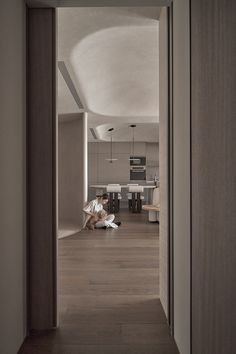 a person sitting on the floor in a room