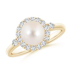 a white pearl and diamond ring with rose gold accents on the band, set in 18k yellow gold