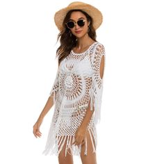 Embrace beachside elegance with our Anna-Kaci Women's White Crochet Cover Up Bathing Suit. Crafted from a blend of 65% Cotton and 35% Polyester, this cover-up features intricate crochet patterns and fringe trim for a stylish beachwear look. Beach Dresses With 3/4 Sleeves For Summer, White Crochet Beachwear Dress For Beach, White Crochet Beachwear Dress For Beach Party, White Crochet Dress For Beach In Summer, Summer Bohemian Crochet Dress With Tassels, White Crochet Dress For Beach Vacation, Bohemian Summer Crochet Dress With Tassels, White Crochet Dress For Summer Beach, White Crochet Dress For Beach Party Vacation