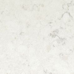 a white marble counter top textured with light gray and dark grey speckles